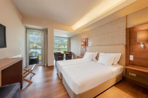 Кровать или кровати в номере The Views Baia - Adults Only