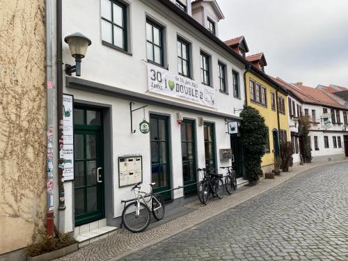 a group of bikes parked in front of a building at Double B in Erfurt