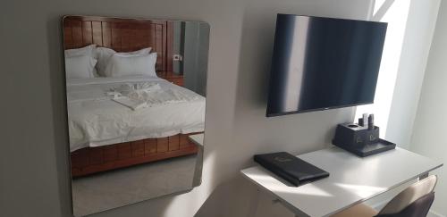 Ένα ή περισσότερα κρεβάτια σε δωμάτιο στο Eastern City Hotel