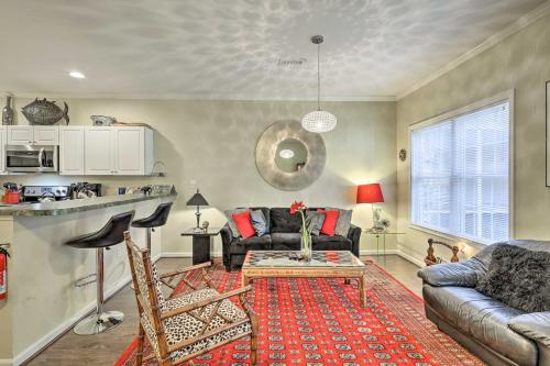 a living room with a couch and a table at 2 Mi to Ocean Rehoboth Beach Townhome with Grill! in Rehoboth Beach