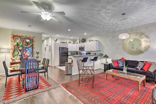 a living room with a couch and a table at 2 Mi to Ocean Rehoboth Beach Townhome with Grill! in Rehoboth Beach