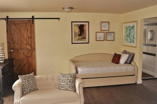 a living room with a bed and a couch at The Gateway in Grand Forks