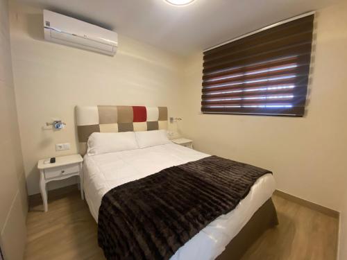 Cama o camas de una habitación en CL LUXURY APARTMENT FIRST LINE BEACH