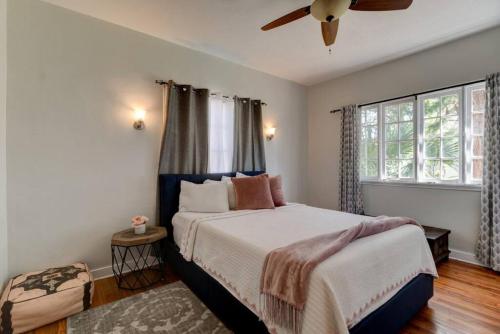 a bedroom with a bed and a ceiling fan at Spanish Beach Bungalow MainHouse in Daytona Beach
