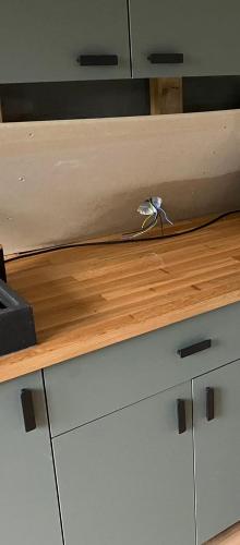 a kitchen counter with a wooden counter top at LaCabane in Cormondreche