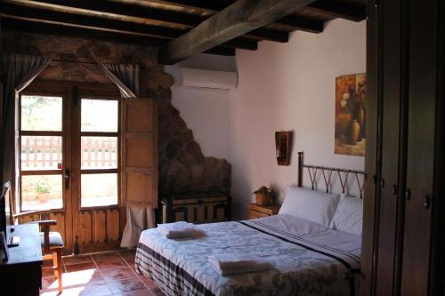 Cama o camas de una habitación en Casa Rural de Agroturismo el Vallejo