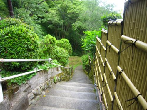 a path with a fence in a garden at Miyoshino Sakuraan in Yoshino