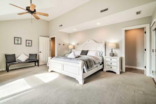 a bedroom with a white bed and a ceiling fan at Nashville Area Family Getaway with Private Pool! in Pegram