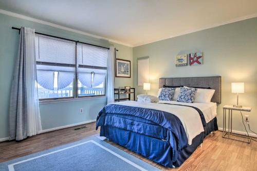 a bedroom with a large bed and a window at Milton Townhouse about 9 Mi to Delaware Bay! in Milton