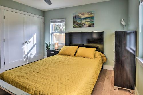 a bedroom with a bed with a yellow bedspread at Emerald Coast Vacation Rental 1 Mi to Beach in Shalimar