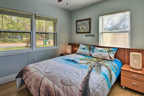 a bedroom with a bed and two windows at Emerald Coast Vacation Rental 1 Mi to Beach in Shalimar