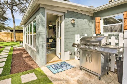 a backyard patio with a barbecue grill and a patio door at Emerald Coast Vacation Rental 1 Mi to Beach in Shalimar