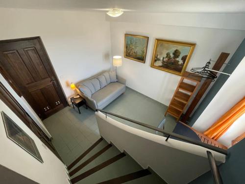 a view of a living room with a couch at Maison au cœur de Sablet & terrasse panoramique in Sablet