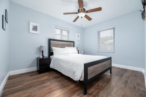 a bedroom with a bed and a ceiling fan at Home at Poinsettia Heights in Fort Lauderdale