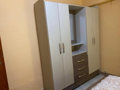 an empty closet with white cabinets and a mirror at Hotel Itavera in Puerto Iguazú