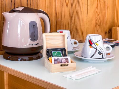 a coffee maker sitting on top of a counter at Atmosphere Hotel in Les Deux Alpes
