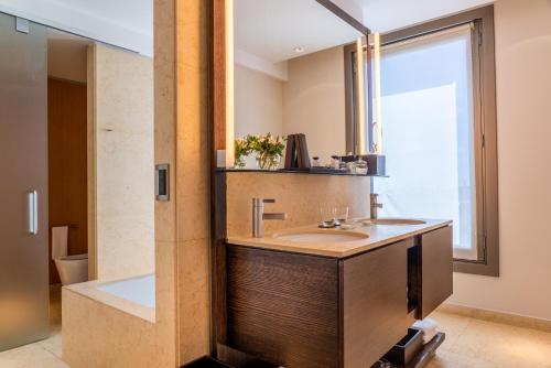 a bathroom with a sink and a shower at Palacio Duhau - Park Hyatt Buenos Aires in Buenos Aires