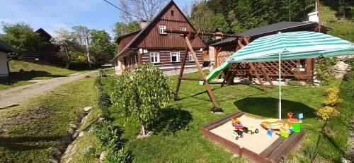 an overhead view of a playground with an umbrella at Chalupa Čistá v Krkonoších 8 in Cerny Dul