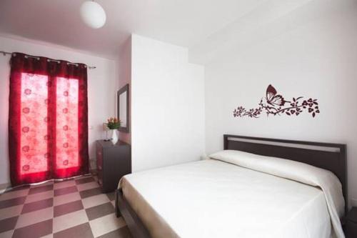Postel nebo postele na pokoji v ubytování Casa Vacanza Nina