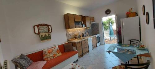 a kitchen with a couch and a table in a room at Zahner studio in Pitsidia