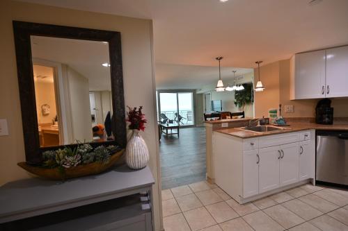 a kitchen with a large mirror on the wall at Gorgeous Condo 3 Br 3 Balconies SB 11th Floor in Myrtle Beach
