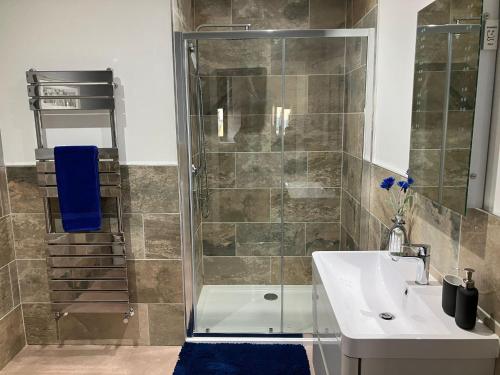 a bathroom with a shower and a sink at Kirkview in Johnshaven