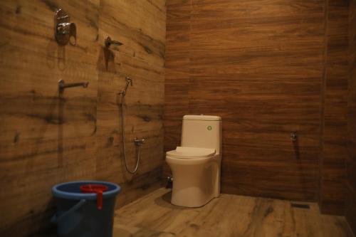 a bathroom with a toilet and a shower at HYDEPARK REGENCY in Palakkad