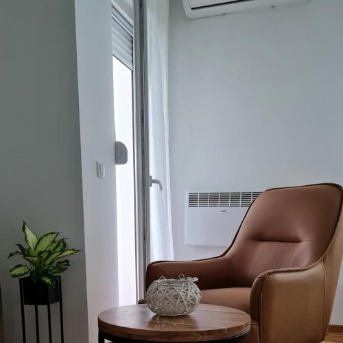Ein Sitzbereich in der Unterkunft Apartman TIM LUX 1