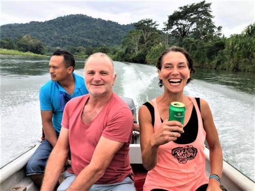 two men and a woman in a boat on a river at Terra NaturaMa - off grid living in the jungle in Punta Uva