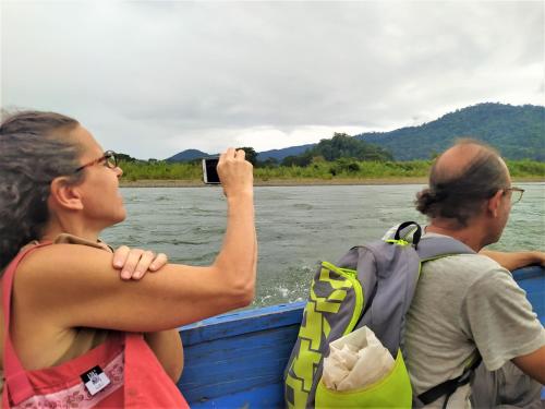 two people on a boat on the river at Terra NaturaMa - off grid living in the jungle in Punta Uva
