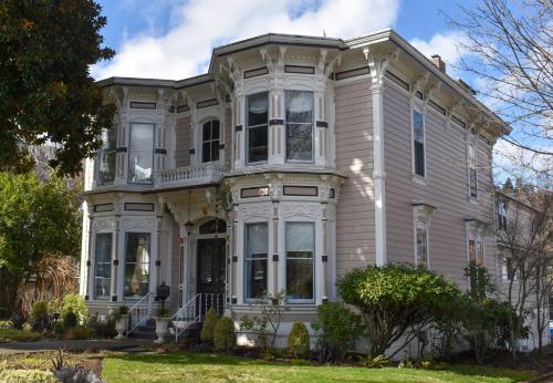 a large house with white trim at McCall House Boutique Hotel in Ashland