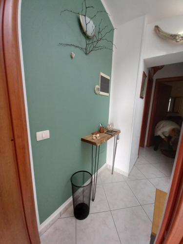a hallway with a small table in a room at Arra Camere Sirolo - Rooms & Suite in Sirolo