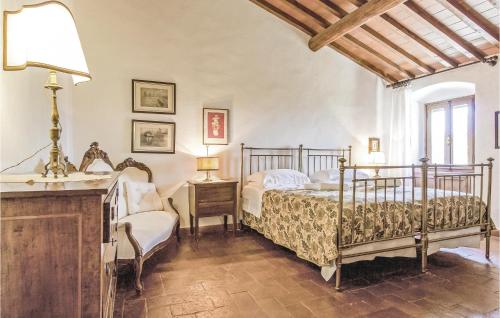 a bedroom with two beds and a table with a lamp at Tutignano in Pontassieve