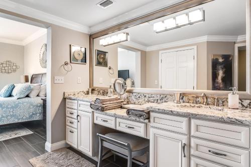 a bathroom with two sinks and a large mirror at Spanish Key 204 in Perdido Key