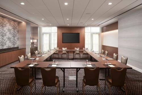 a large conference room with a large table and chairs at Loews Coral Gables Hotel in Miami