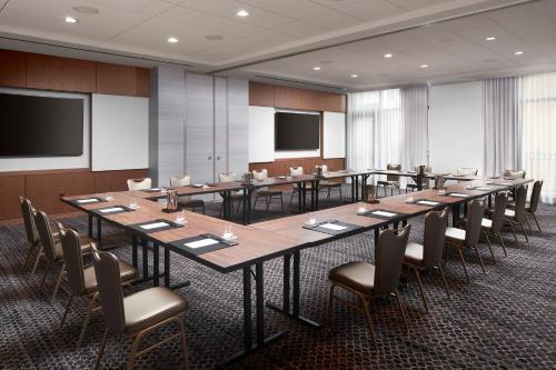 a conference room with a long table and chairs at Loews Coral Gables Hotel in Miami