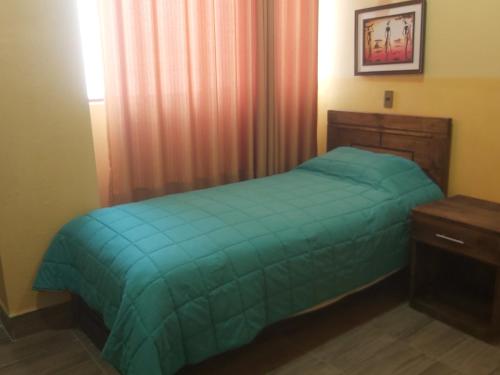 Ein Bett oder Betten in einem Zimmer der Unterkunft Beliz Inn
