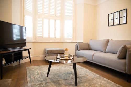 a living room with a couch and a table at 35 Grosvenor Terrace - 3 Bed Sleeps 6, 5 min walk from York City Centre in York
