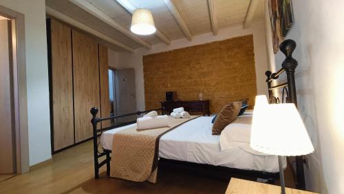 Postel nebo postele na pokoji v ubytování La Terrazza Di Athena sweet rooms