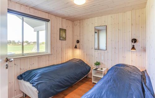 Ένα ή περισσότερα κρεβάτια σε δωμάτιο στο Gorgeous Home In Stege With Sauna