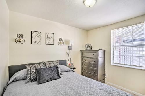 a bedroom with a bed and a dresser and a window at Lakeland Vacation Rental 38 Mi to Disney! in Lakeland