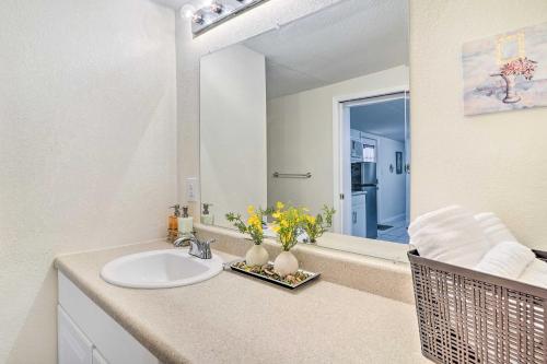 a bathroom with a sink and a mirror at Lakeland Vacation Rental 38 Mi to Disney! in Lakeland