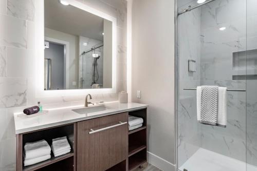 a bathroom with a sink and a shower at Cambria Hotel Austin Uptown near the Domain in Austin