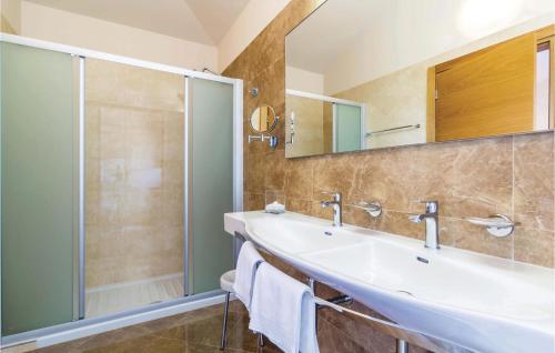 a bathroom with a sink and a shower at 4 Bedroom Beautiful Home In Turcic in Vantačići