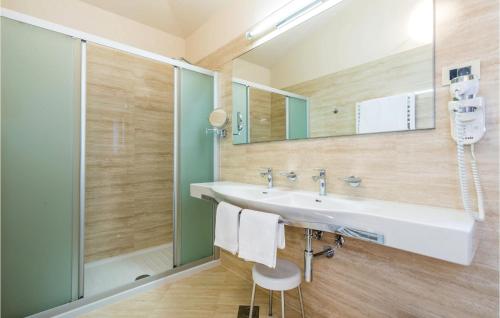 a bathroom with a sink and a shower at Beautiful Home In Turcic With Wifi in Vantačići