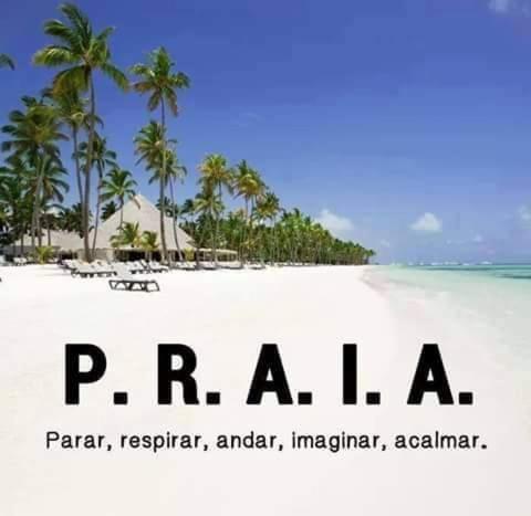 a beach with palm trees and the words parnaachi on it at Pouso Paraty in Paraty