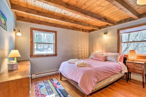 a bedroom with a bed and a wooden ceiling at West Cornwall Cabin about 4 Mi to Covered Bridge! in West Cornwall
