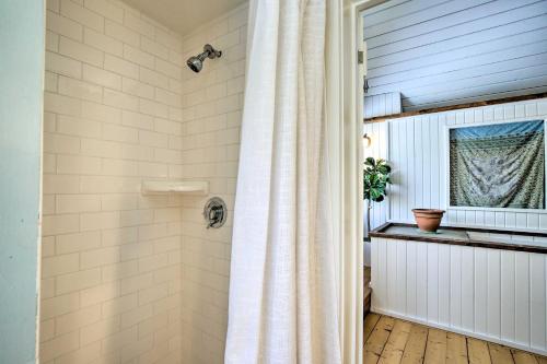 a shower with a white shower curtain in a bathroom at West Cornwall Cabin about 4 Mi to Covered Bridge! in West Cornwall
