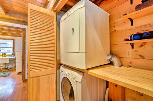 a kitchen with a refrigerator and a washer and dryer at West Cornwall Cabin about 4 Mi to Covered Bridge! in West Cornwall