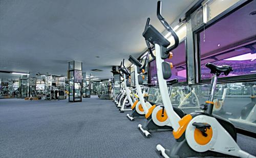 a row of exercise bikes in a gym at Horison Ultima Bandung in Bandung
